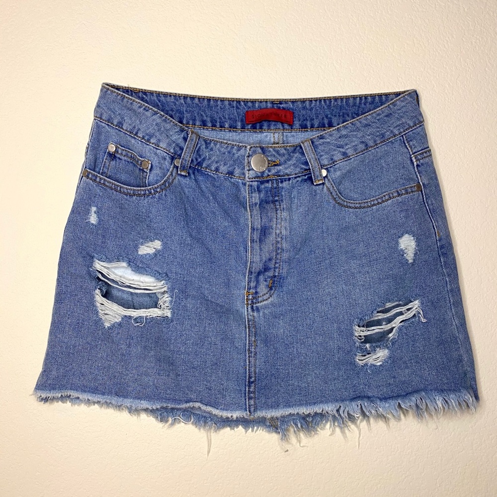 Distressed denim mini skirt